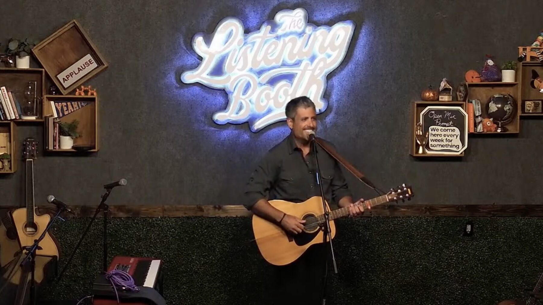 Brody Bond under a neon sign
